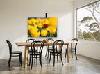 Red Among Yellow Tulips floral canvas print on the wall of a dining room