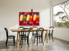 Tulip Trio Glow floral canvas print on the wall of a dining room