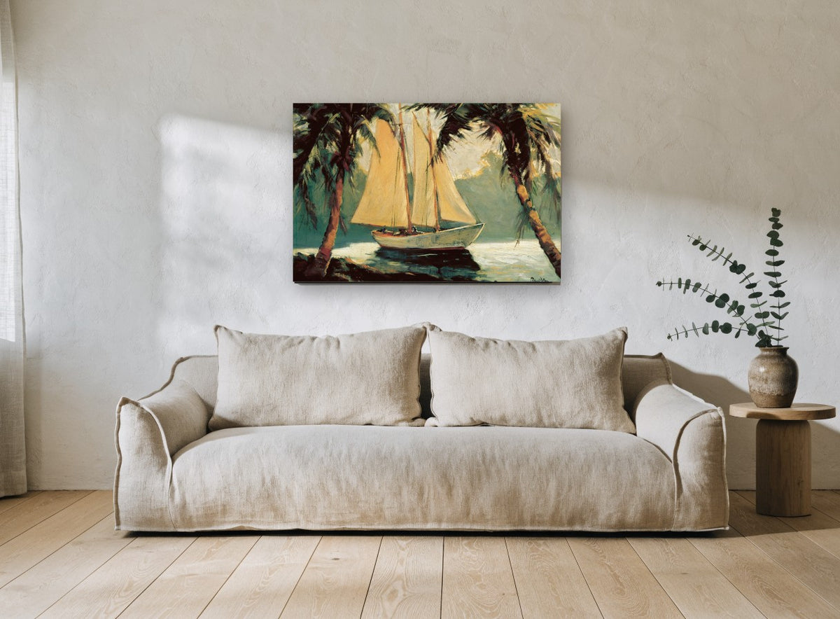 Schooner Between Palms coastal canvas print on the wall of a living room