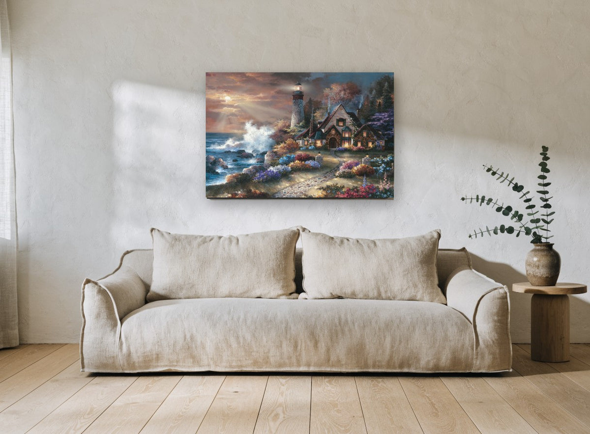 Lighthouse Cottage Glow coastal canvas print on the wall of a living room