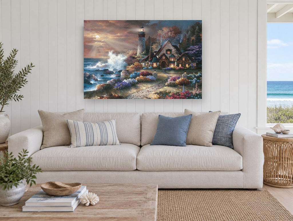 Lighthouse Cottage Glow coastal canvas print on the wall of a beach house living room