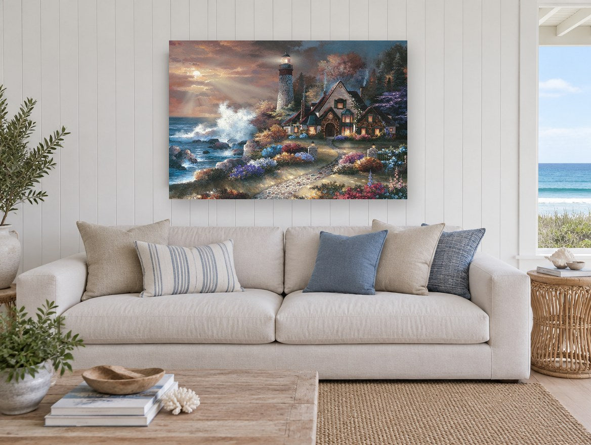 Lighthouse Cottage Glow coastal canvas print on the wall of a beach house living room