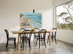 Two Chairs at the Shore coastal canvas print on the wall of a dining room