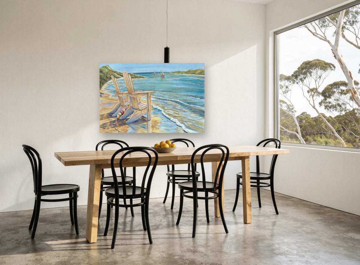 Two Chairs at the Shore coastal canvas print on the wall of a dining room