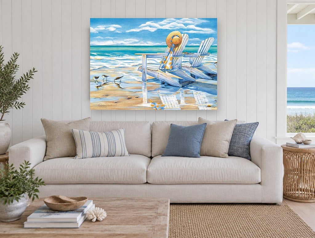 Sandpipers and Beach Chairs coastal canvas print on the wall of a beach house living room