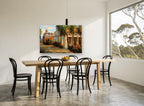 Palm Courtyard Afternoon floral canvas print on the wall of a dining room