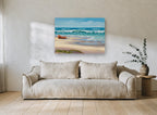 Sandpipers and Beached Boat coastal canvas print on the wall of a living room