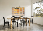 Open Doors to Sunset coastal canvas print on the wall of a dining room