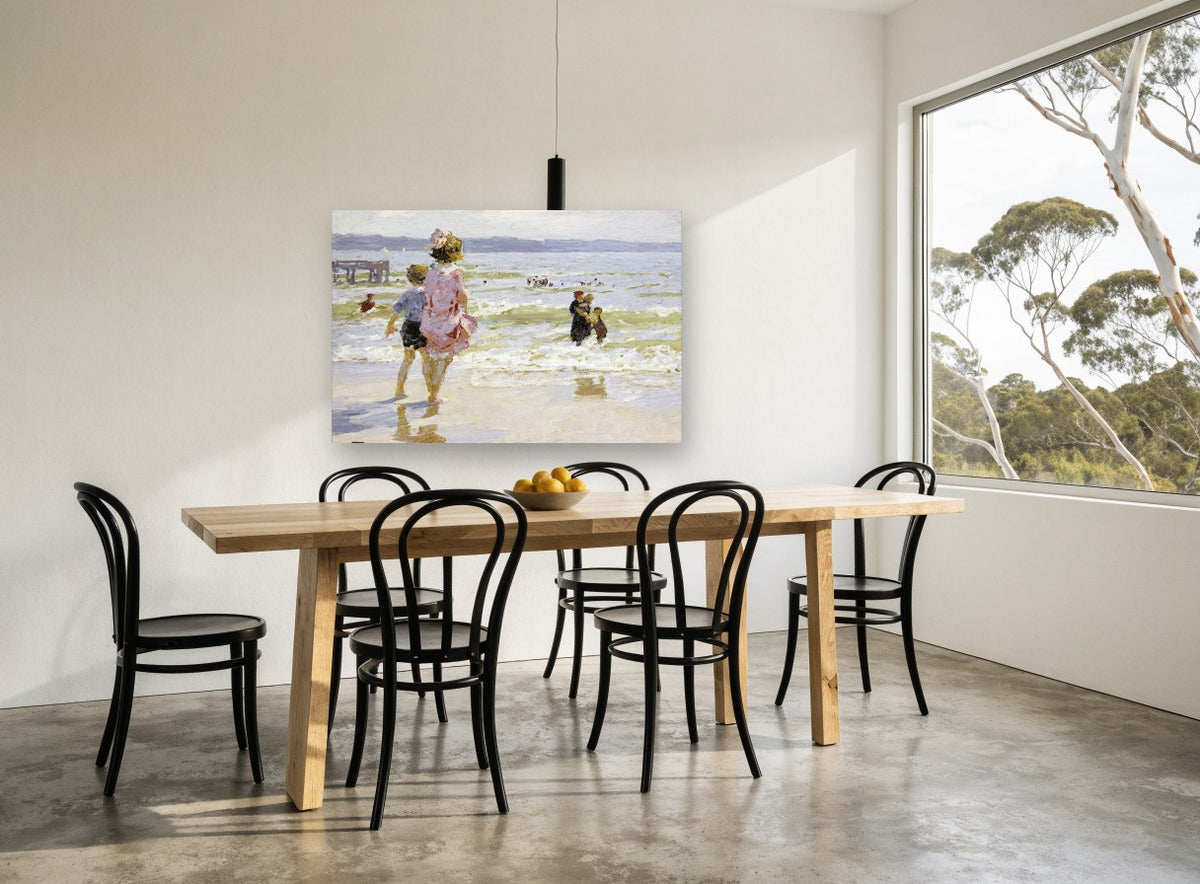 Children at the Shallows coastal canvas print on the wall of a dining room