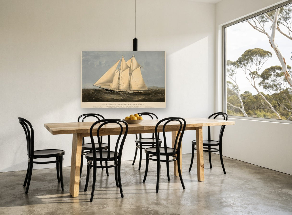 Schooner Under Full Sail coastal canvas print on the wall of a dining room
