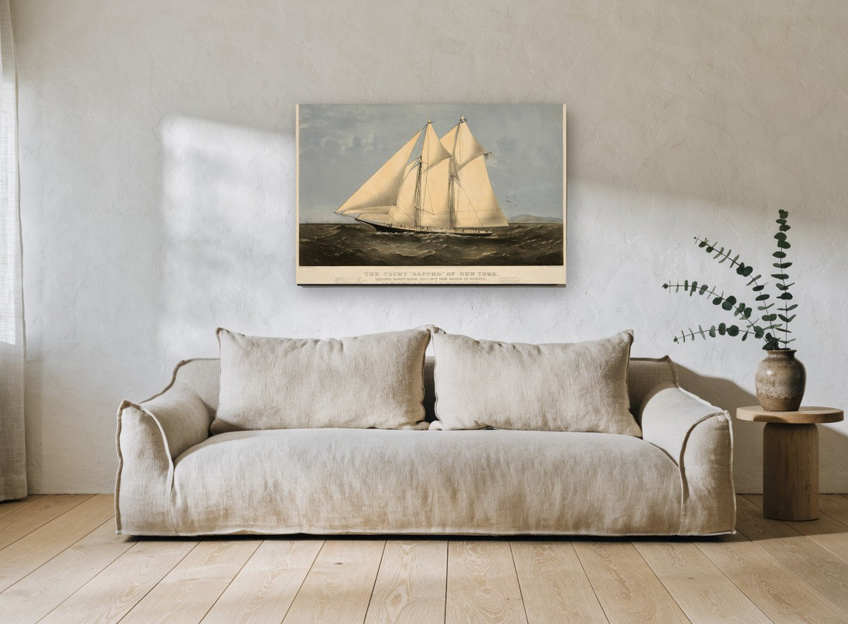 Schooner Under Full Sail coastal canvas print on the wall of a living room