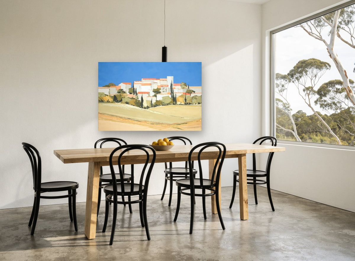 Hilltop Village Blue Sky landscape canvas print on the wall of a dining room