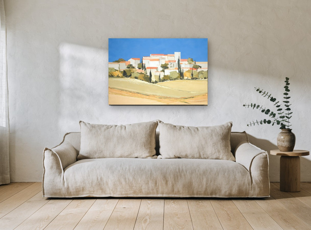 Hilltop Village Blue Sky landscape canvas print on the wall of a living room