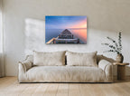 Dusk Along the Old Pier coastal canvas print on the wall of a living room