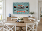 Welcome to Our Happy Home vintage canvas print on the wall of a Hamptons dining room
