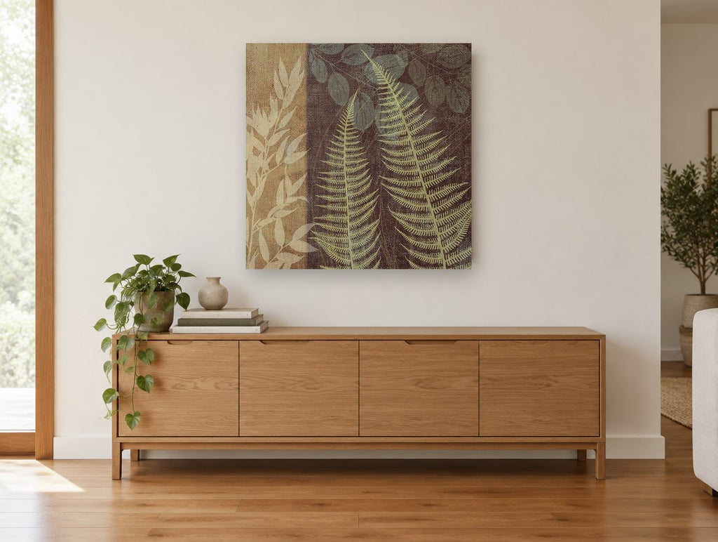 Fern Fronds on Burlap floral canvas print on the wall of a living room above a sideboard