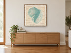 Teal Shell Vocabulary coastal canvas print on the wall of a living room above a sideboard