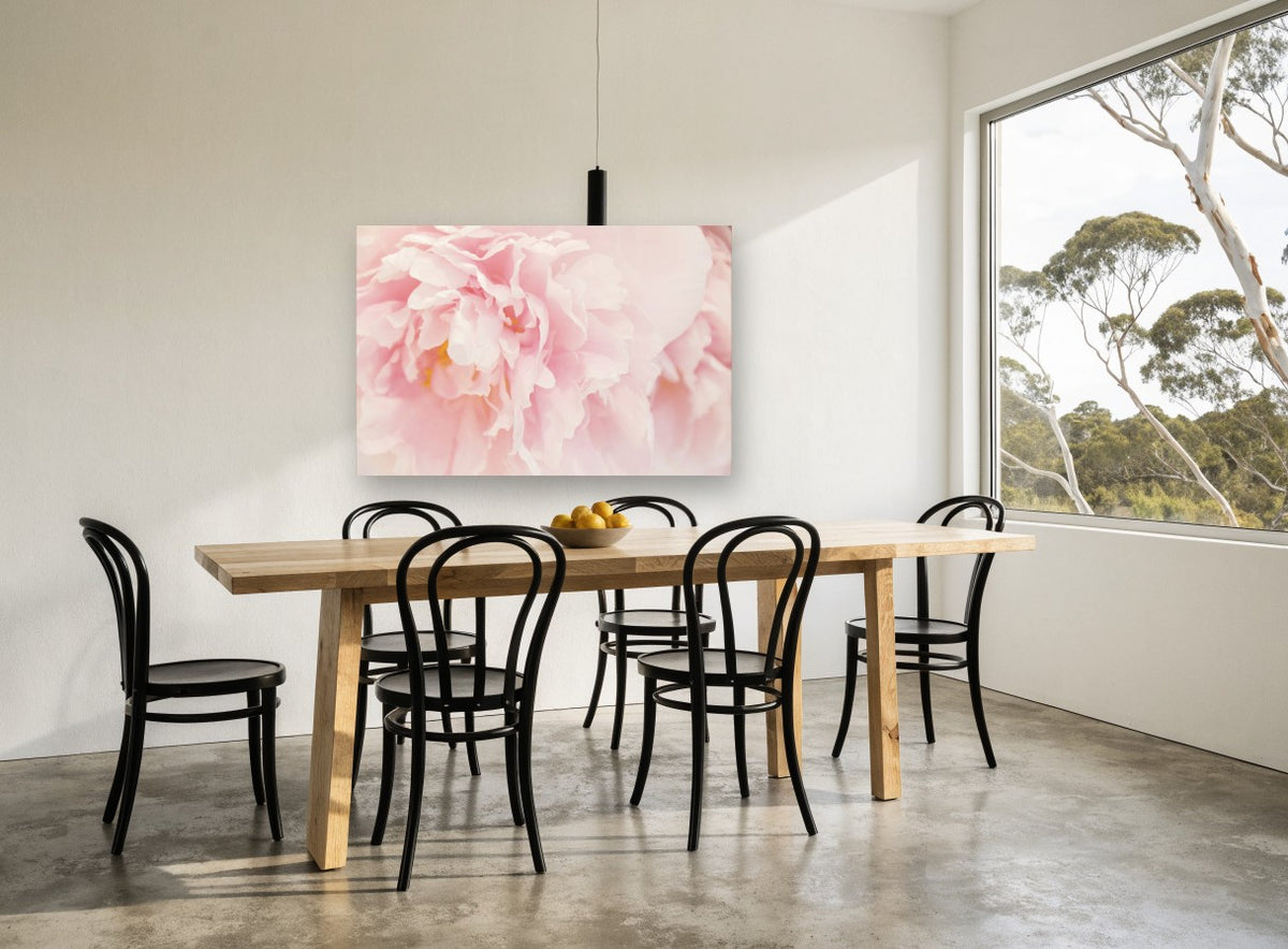 Blush Peony Bloom floral canvas print on the wall of a dining room