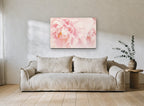 Blush Peony Bloom floral canvas print on the wall of a living room