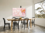 Soft Blush Peonies floral canvas print on the wall of a dining room