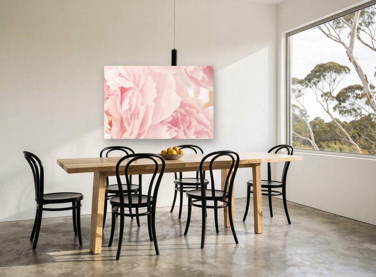 Soft Pink Peony Layers floral canvas print on the wall of a dining room