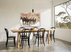 Six Horses in Snow vintage canvas print on the wall of a dining room