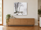 Winter Shore Fog landscape canvas print on the wall of a living room above a sideboard