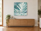 Cream Fronds on Teal floral canvas print on the wall of a living room above a sideboard