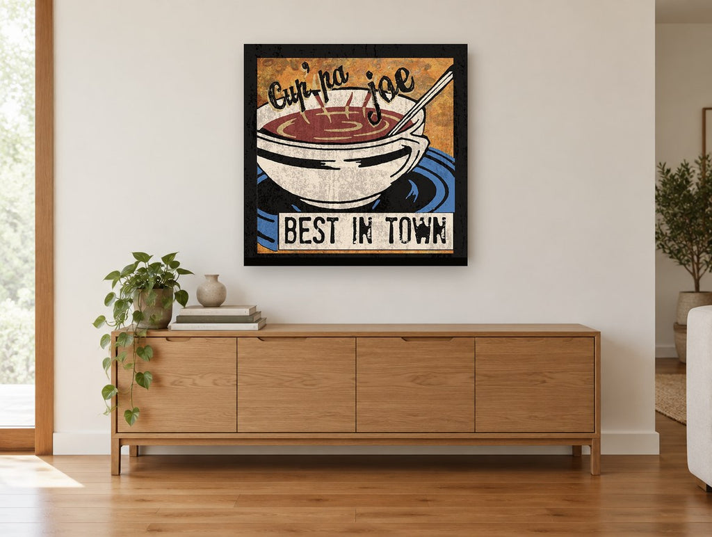 Cup'pa Joe Coffee vintage canvas print on the wall of a living room above a sideboard