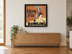 Have Fun Bowling vintage canvas print on the wall of a living room above a sideboard