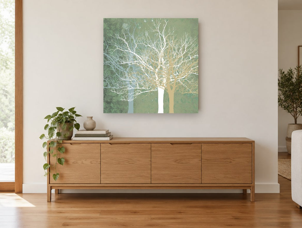 Sage Winter Branches landscape canvas print on the wall of a living room above a sideboard