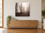 Sepia Fog Lane landscape canvas print on the wall of a living room above a sideboard