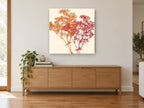 Orange and Red Gypsophila floral canvas print on the wall of a living room above a sideboard