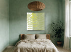 Layered Green Fronds floral canvas print on the wall of a bedroom