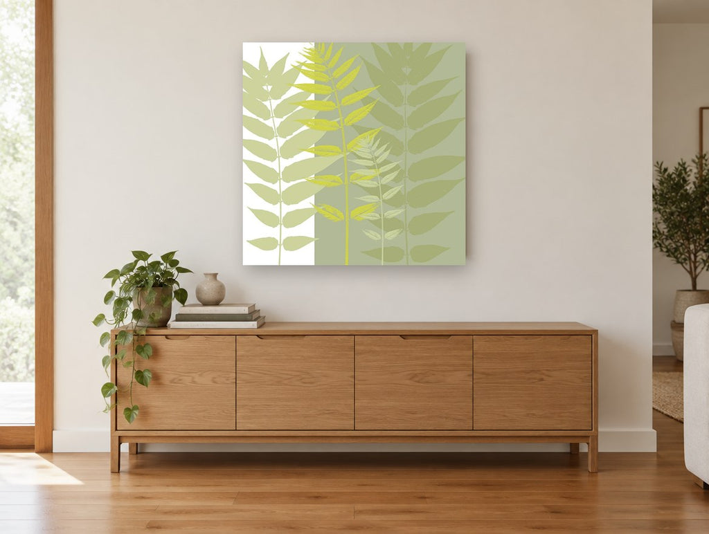 Layered Green Fronds floral canvas print on the wall of a living room above a sideboard