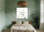 Two Birds Among Seedheads floral canvas print on the wall of a bedroom