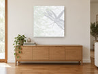 Dragonfly on Lace animal canvas print on the wall of a living room above a sideboard