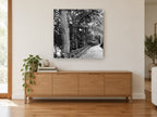Lamplit Park Path landscape canvas print on the wall of a living room above a sideboard