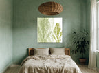 Three Green Stems floral canvas print on the wall of a bedroom