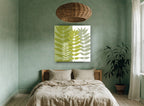 Olive Split Leaf Silhouettes floral canvas print on the wall of a bedroom
