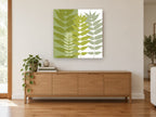 Olive Split Leaf Silhouettes floral canvas print on the wall of a living room above a sideboard