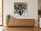 Bare Oak Silhouette landscape canvas print on the wall of a living room above a sideboard