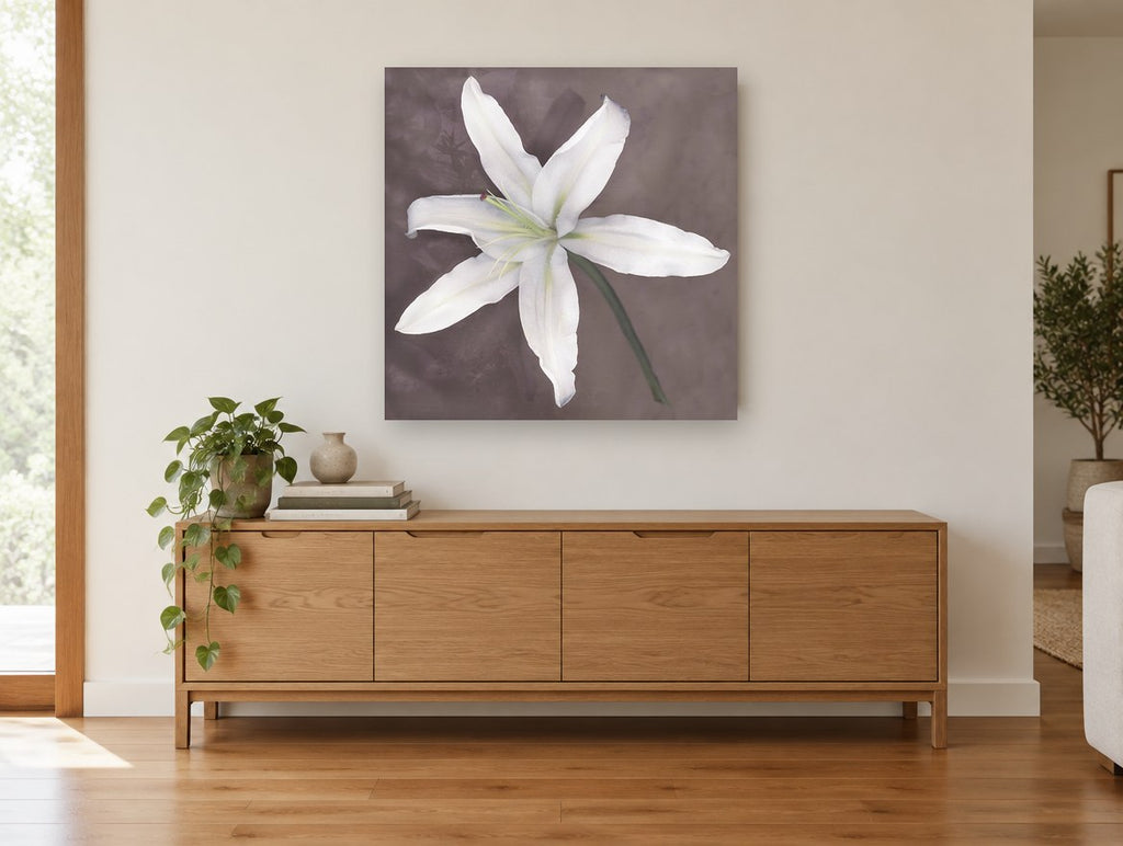 Pale Lily Bloom floral canvas print on the wall of a living room above a sideboard