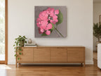 Rose Pink Hydrangea floral canvas print on the wall of a living room above a sideboard