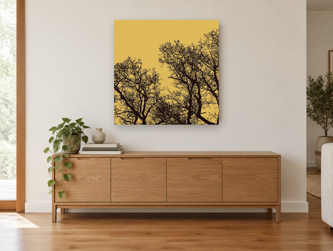 Ochre Branch Silhouettes landscape canvas print on the wall of a living room above a sideboard