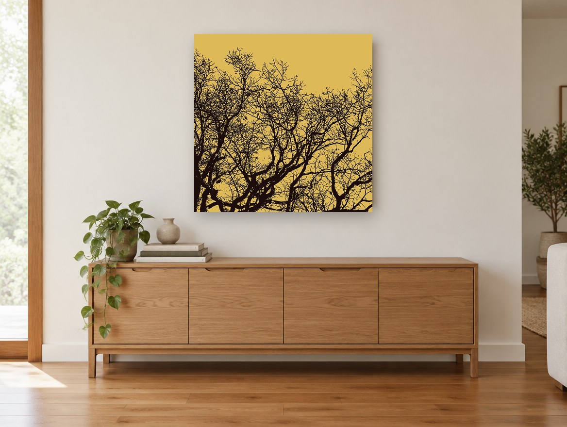 Golden Branch Silhouette landscape canvas print on the wall of a living room above a sideboard