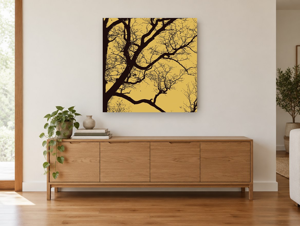 Ochre Branch Silhouette landscape canvas print on the wall of a living room above a sideboard