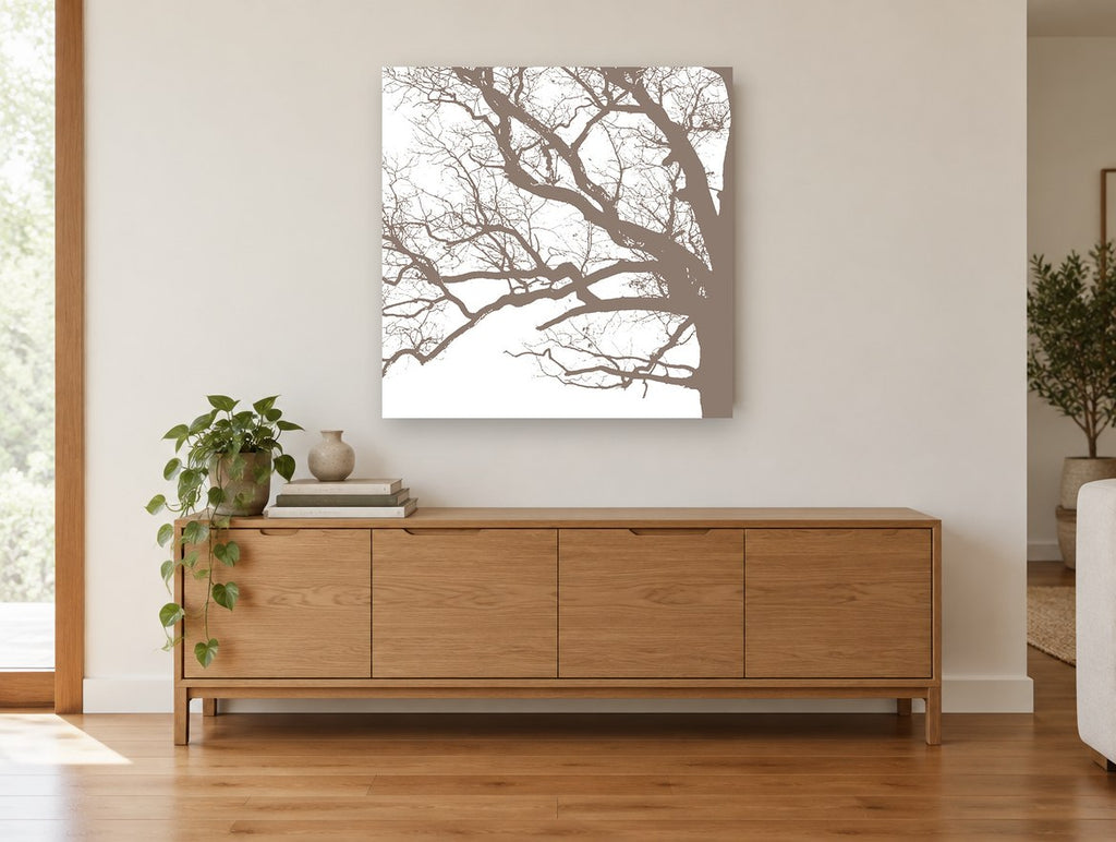 Taupe Oak Branch Tracery landscape canvas print on the wall of a living room above a sideboard