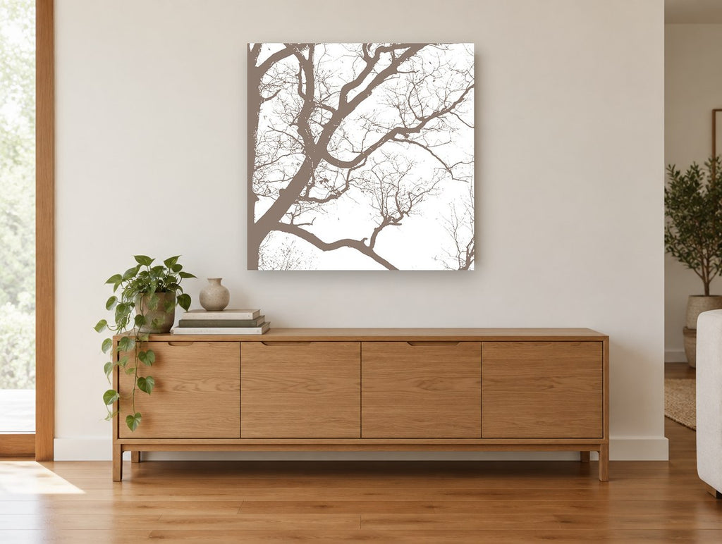 Winter Branch Silhouette landscape canvas print on the wall of a living room above a sideboard