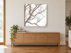 Winter Branch Silhouette landscape canvas print on the wall of a living room above a sideboard